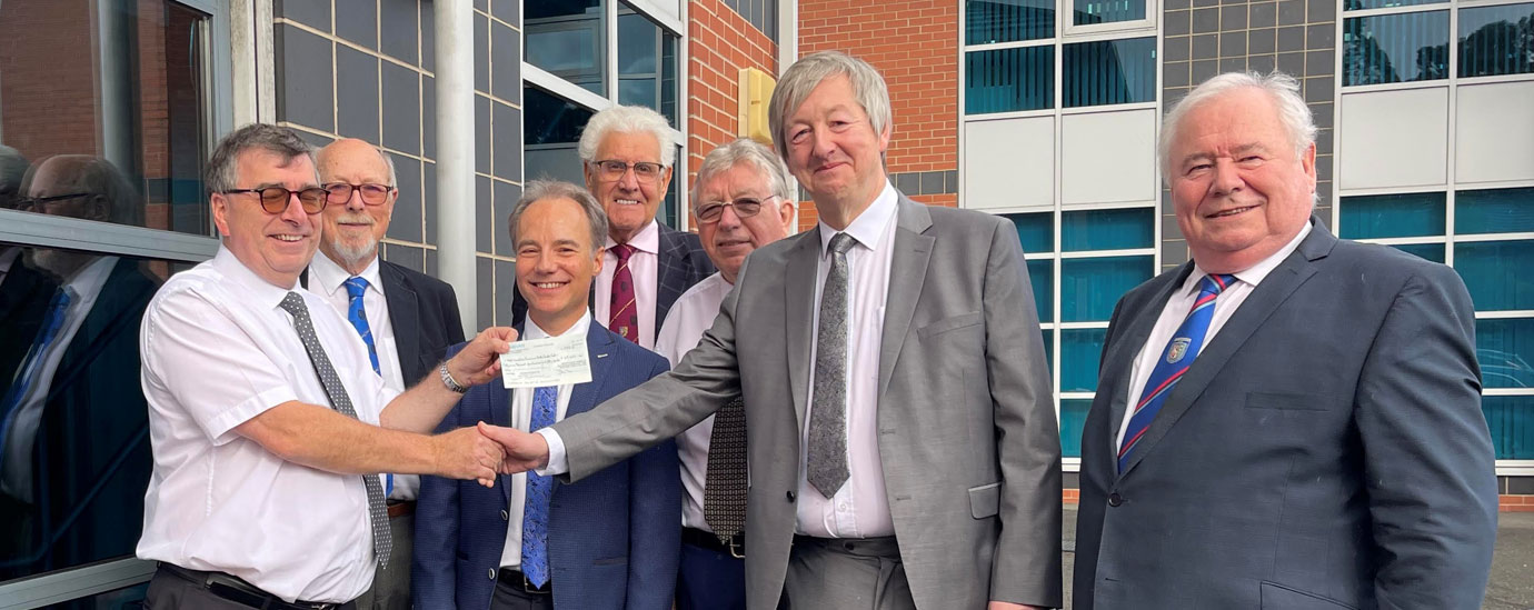 Pictured from left to right, are: Paul McLachlan, Mike Heather, Jonathon Heaton, Malcolm Warren, Alan Riley Steve Gregory receiving a cheque and Peter Hegarty.