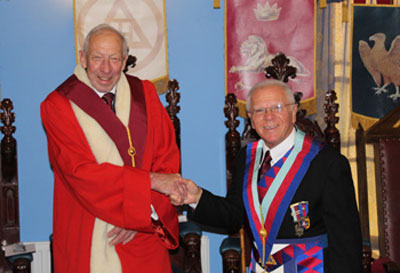 Derek (right) congratulates Joe on his installation.