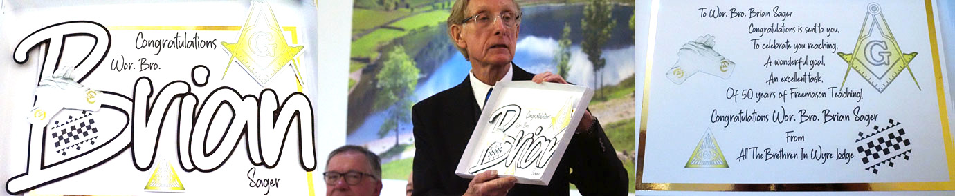 Brian Sager (centre) with details from his greeting card from the members of Wyre Lodge.