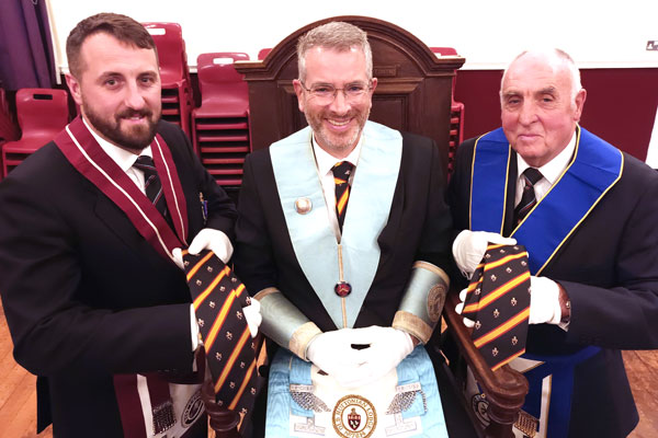 Pictured from left to right, are: David Jenkinson, Damien McKeand and John Medcalf with their new ties.