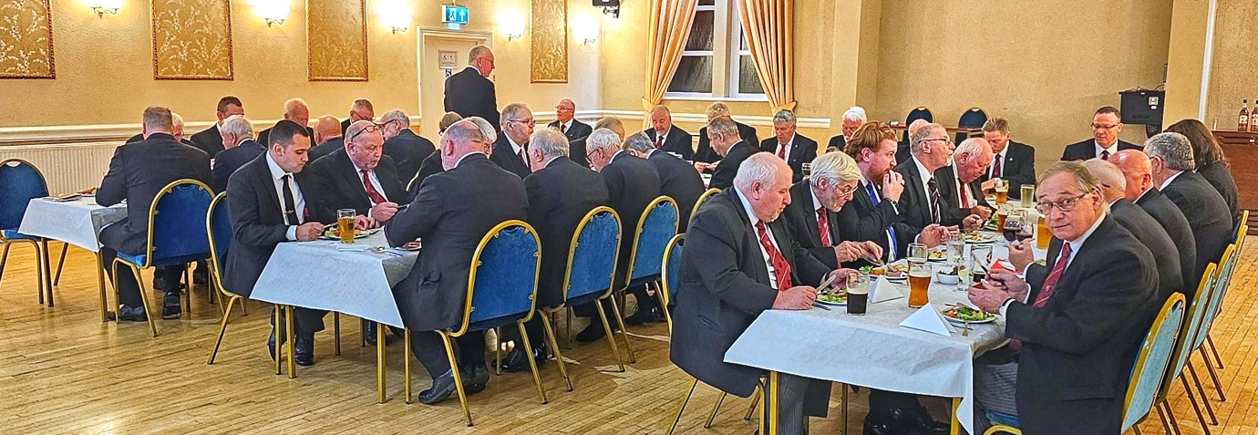 Companions and brethren enjoying a festive board together.