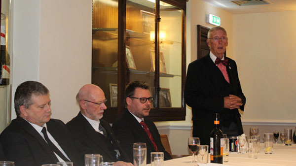 David Codling (right) toasts the health of the three principals.