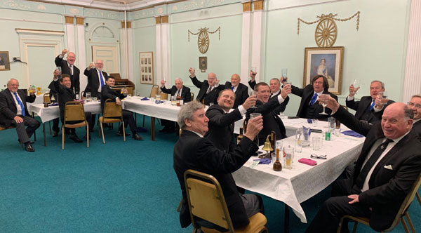 Glasses raised in a toast. Glasses raised in a toast.
