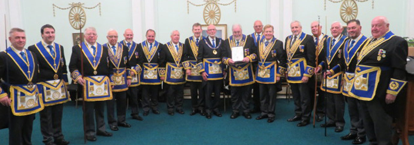 Roy Pyne (central) holding his certificate, with grand and Provincial grand officers. Roy Pyne (central) holding his certificate, with grand and Provincial grand officers.
