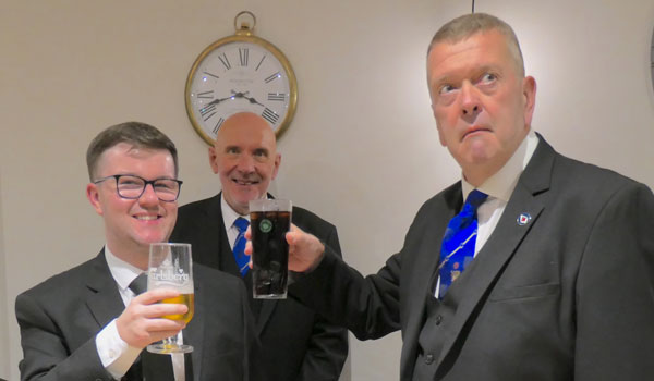 Gary Devlin (right) takes wine with Michael McGuiness watched by DC Chris Lyon. Gary Devlin (right) takes wine with Michael McGuiness watched by DC Chris Lyon.