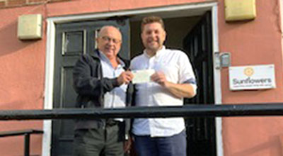 David Ullathorne (left) presenting the cheque to Bobby Magee.