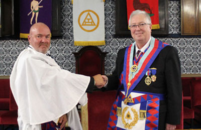 Kevin Hitchmough (left) being congratulated by John Murphy. Kevin Hitchmough (left) being congratulated by John Murphy.