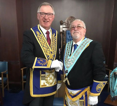 John Robbie Porter (left) congratulates Bill Acton.