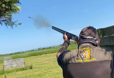 Ian Heyes at the National Shoot with the shot captured leaving the barrel.