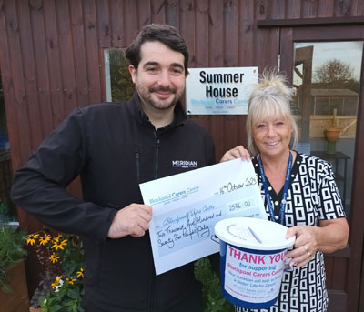 Jon Boriss presenting the £2,576 cheque to Terry Hodkinson. 