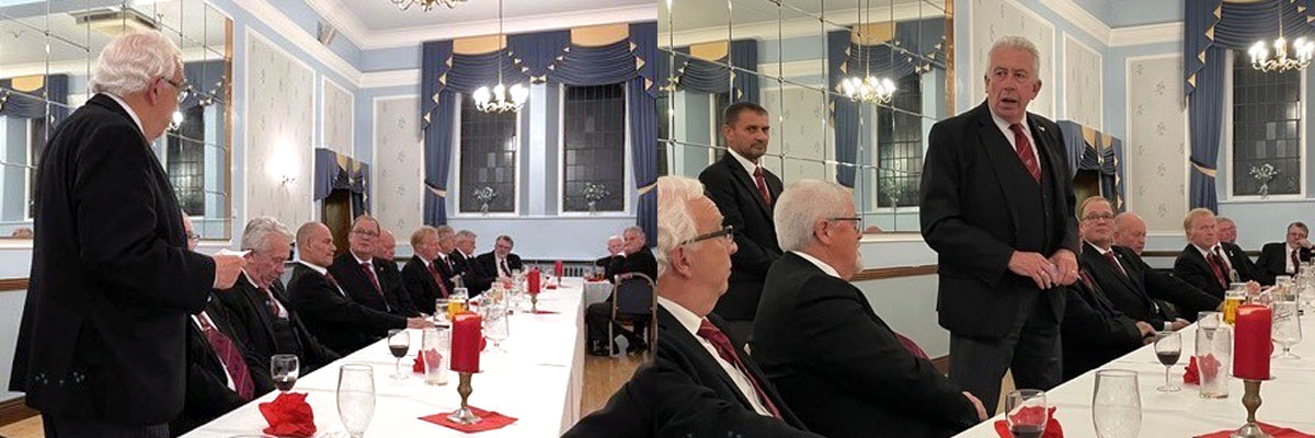 Pictured left: Malcolm Alexander proposes the toast to Mark. Pictured right: Mark responds to the toast to his health.
