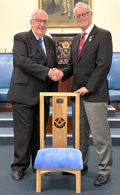 Phil Stock (right) congratulates David on his magnificent donation.