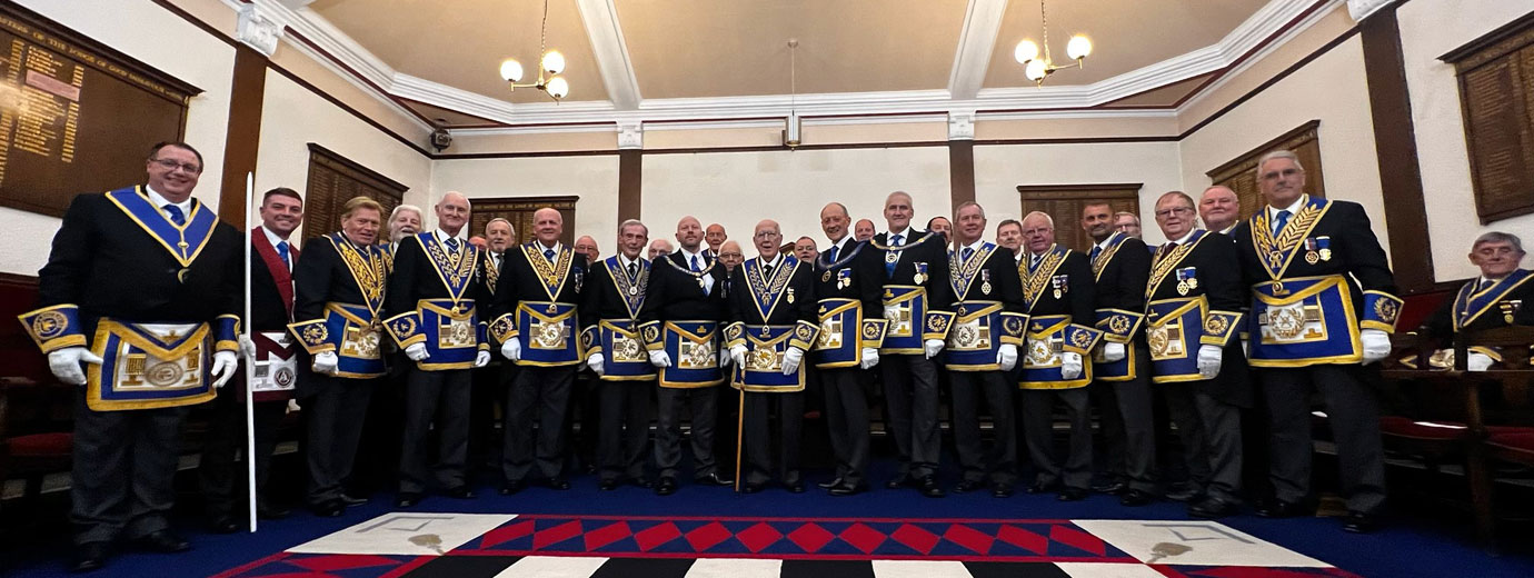 Dennis Rudd (centre) with grand and Provincial grand officers.