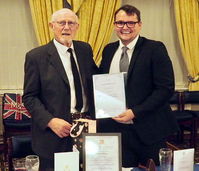 Michael Sjollema (right) presents Bill with a certificate from the lodge.