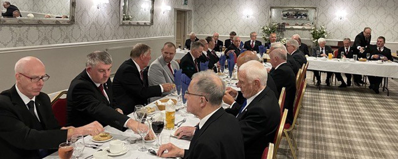 Companions enjoying a splendid festive board following an excellent installation.