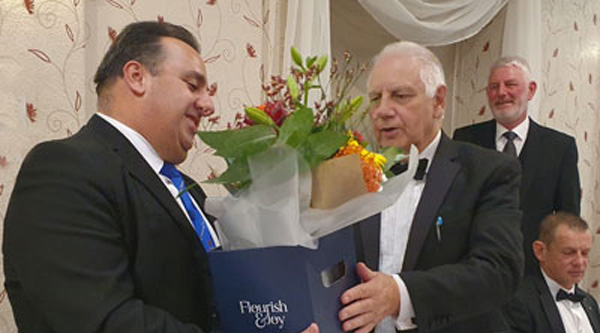 Michael Tax (left) is presented with flowers by Frank Howarth. Michael Tax (left) is presented with flowers by Frank Howarth.
