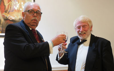 Mike Lumby (left) takes wine with Glenn Priestly.