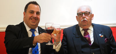 Michael Tax (left) takes wine with Mike Lumby at the festive board.
