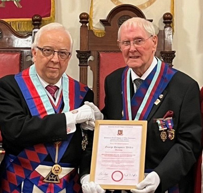 George Wilkie (right) receiving his certificate commemorating his 60 years in Royal Arch Masonry from Malcolm Alexander.