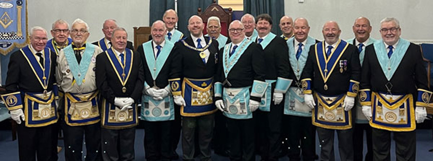 Pictured centre left and right, are: Malcolm Bell and David Hatton with members of the lodge and visitors.