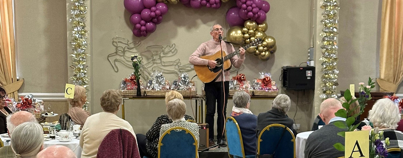 Rob Mason entertaining all the guests with Lancashire songs and anecdotes.