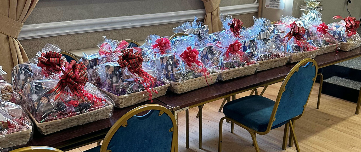 Rows of Christmas hampers ready to gift to each guest.