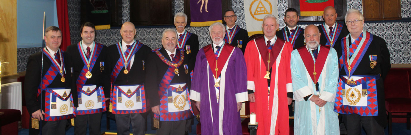 Deputy Grand Superintendent Chris Butterfield with the three principals. Provincial grand officers and guests.