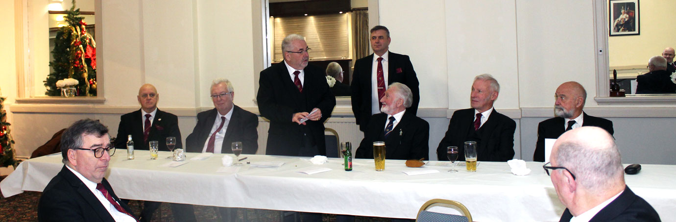 Chris Butterfield congratulates the three principals and companions of the chapter.