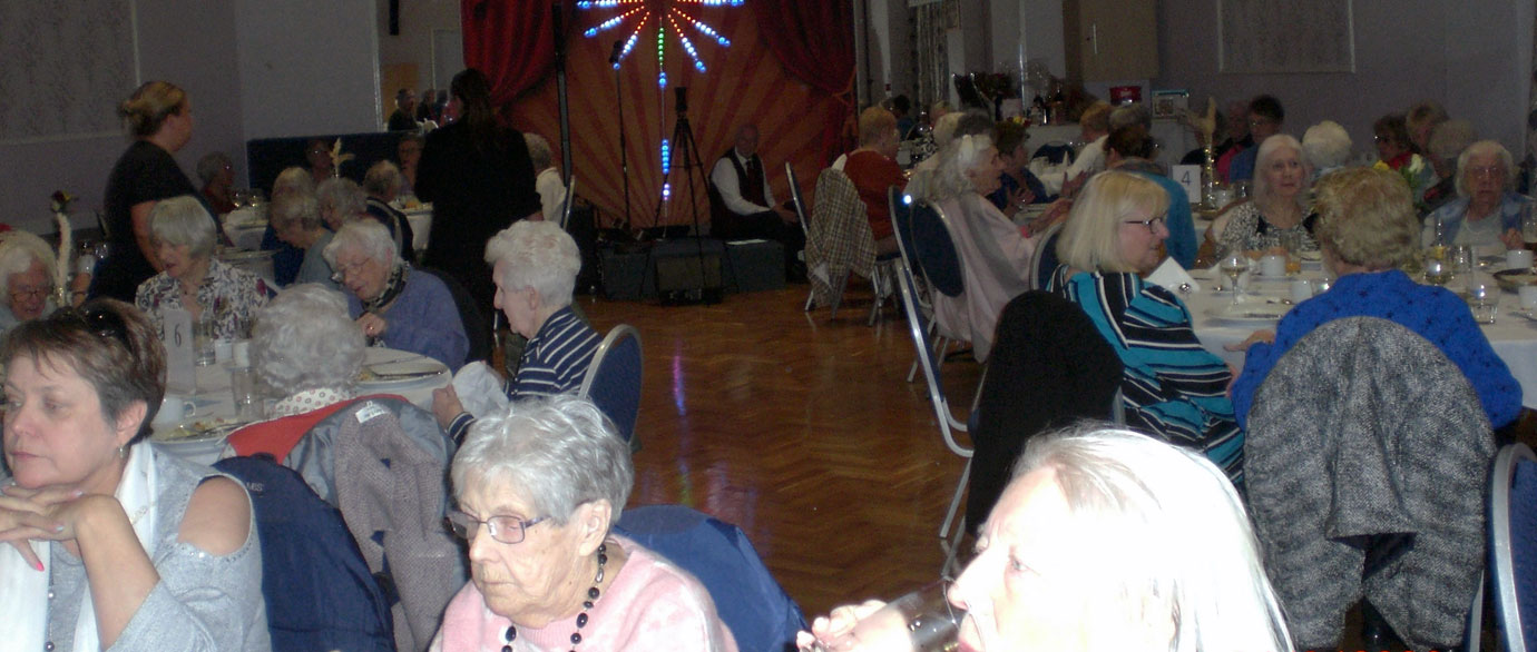 A full house at the widow’s luncheon having a wonderful time.