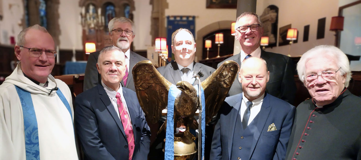 The readers gather around the lectern. Pictured from left to right, are: Rev Martin Keighley, Steve Jelly, David Barr, Ben Gorry, John Robbie Porter, John Cross and Rev Canon Godfrey Hirst.