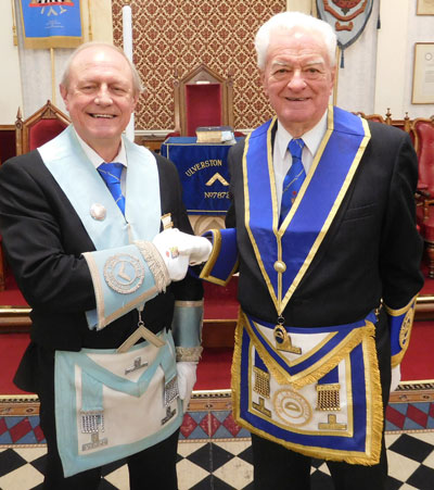 Master of Ulverston Lodge Tony Taylor (left) congratulates Peter Gardner on his jubilee.