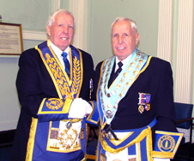 Roy Ashley (left) congratulates his twin brother Bernard Ashley.