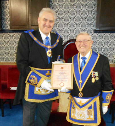 Andrew Whittle (left) presenting Eric Lloyd with his certificate