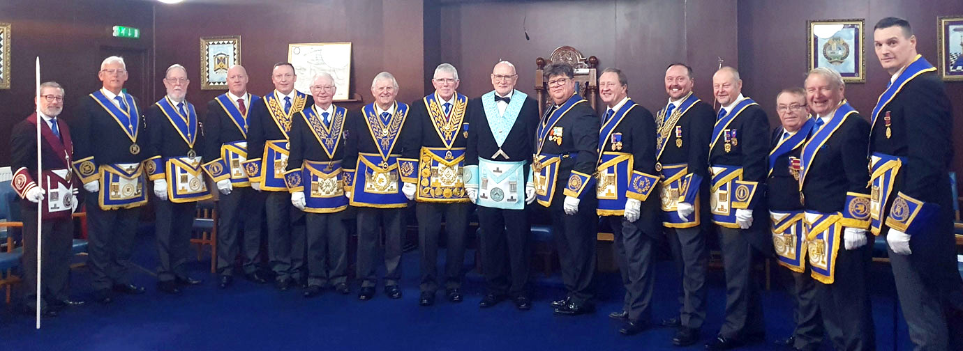 Tony Harrison and the new WM Liam Burns flanked by grand and acting Provincial grand officers.