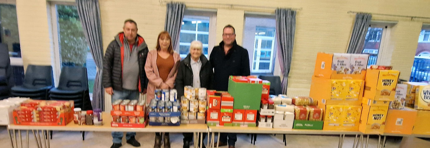 David Parker (left) and Simon Wright (right) with Ashton Food Aid Volunteers.