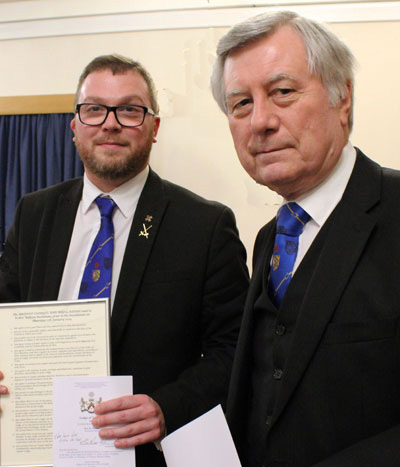  Brian Horrocks (right) presenting Will with a table plan, signed summons and Charges and Regulations