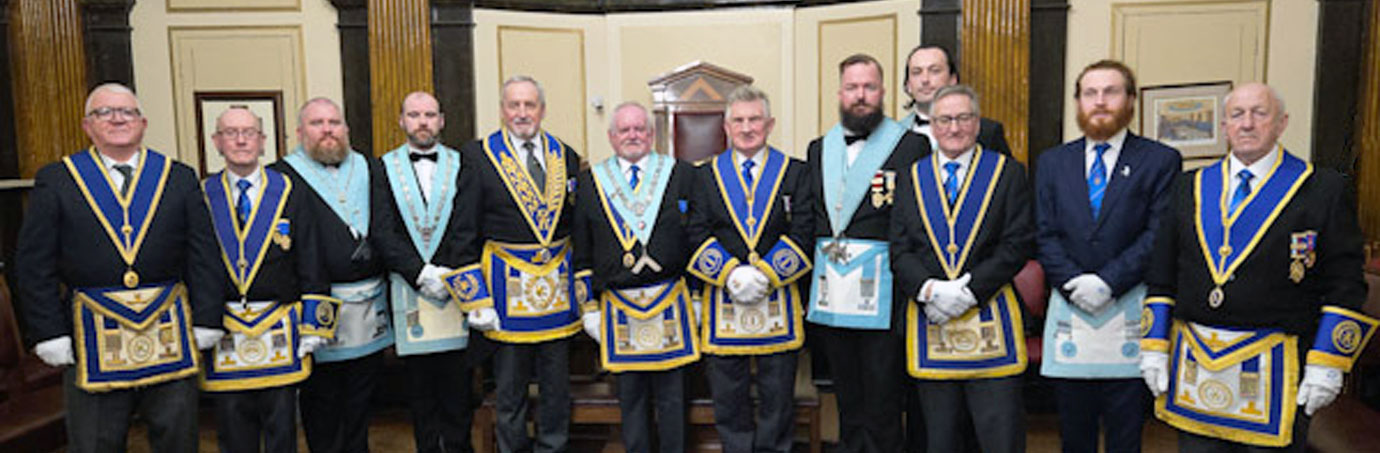 John Lambert (centre) with Sam Robinson (left centre) and brethren of St Peters Lodge.