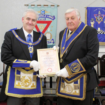 Andrew Whittle (left) presenting David Prince with his certificate.
