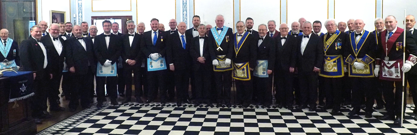 Ian Heyes (centre) surrounded by the members of the lodge.