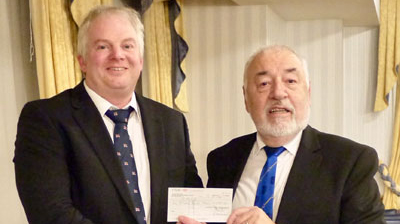 Ian Fowler (right) presents a cheque to Luke Minns.