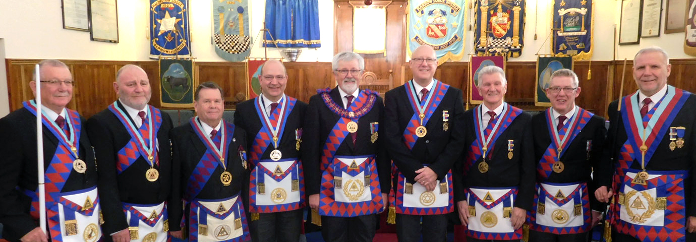A plethora of acting Provincial grand officers attend Third Provincial Grand Principal David Barr (centre).