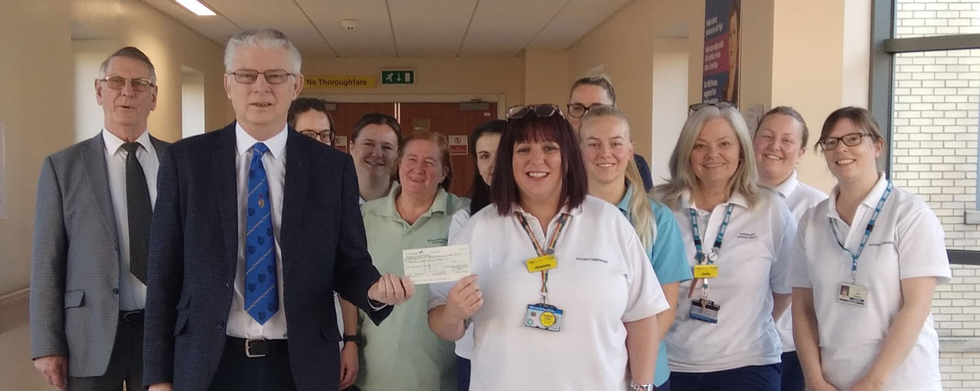 David Rowbotham (left) and Bob Stafford presenting the cheque of £600 to the staff of Cardiac Rehabilitation Unit at Blackpool Victoria Hospital.
