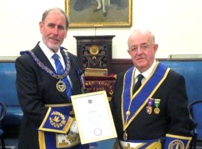 Frank Umbers (left) presents David with his certificate