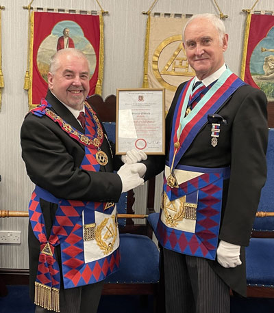Chris Butterfield presenting Stanley Oldfield with his 50-year certificate.