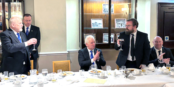 Tom Smith (left) congratulates Joe Lynch on becoming a fellow craft Freemason.