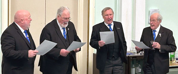 Members of the lodge adding their vocal talents to the evening for the song to the WM.