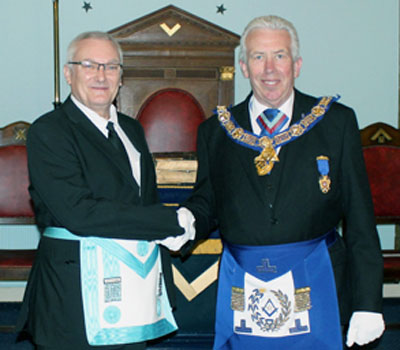 Ian Wilson (left) being congratulated by Mark Matthews.