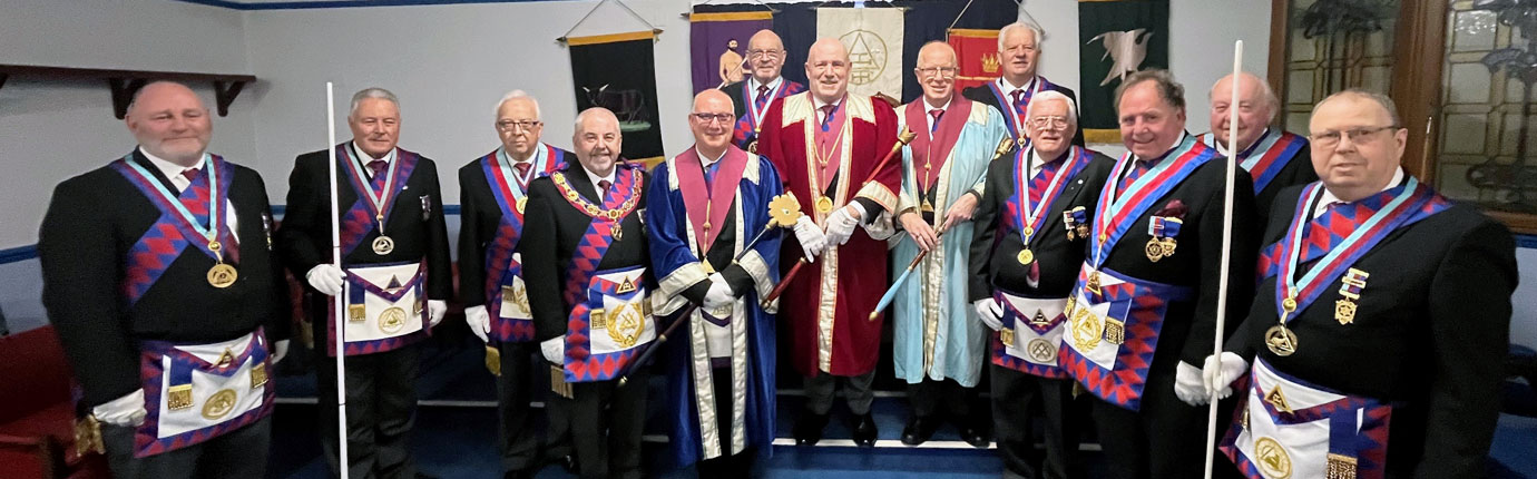 The three principals encircled by grand officers and acting Provincial grand officers.