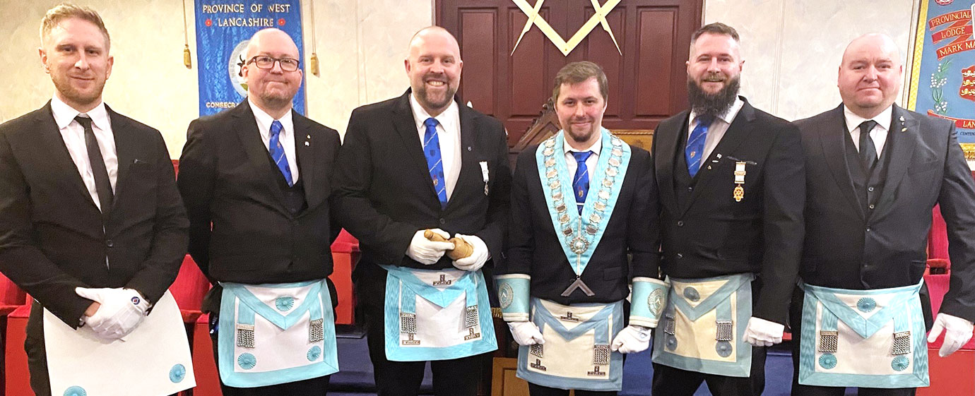 Carnarvon Lodge claiming the traveling gavel from Tyldesley Lodge WM.