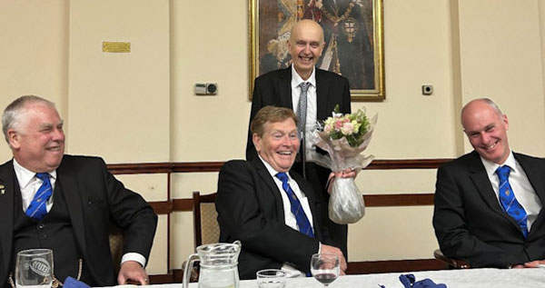 Pictured from left to right, are: Dave Johnson, Kevin Poynton being presented with a gift by John Cherry and Andy Williamson.